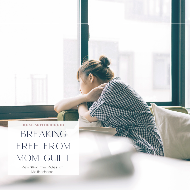 Woman sitting on a couch next to a window, looking out in deep thought.