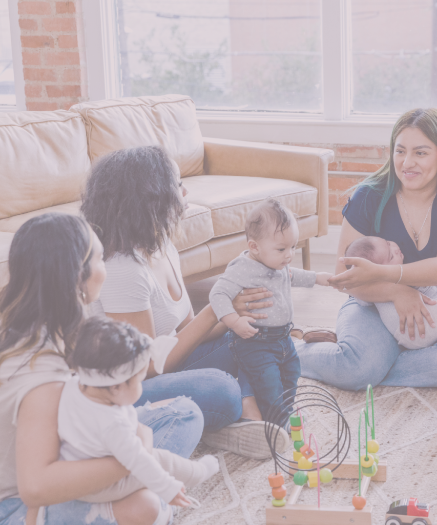 Modern moms group of three women talking and connecting with babies playing.